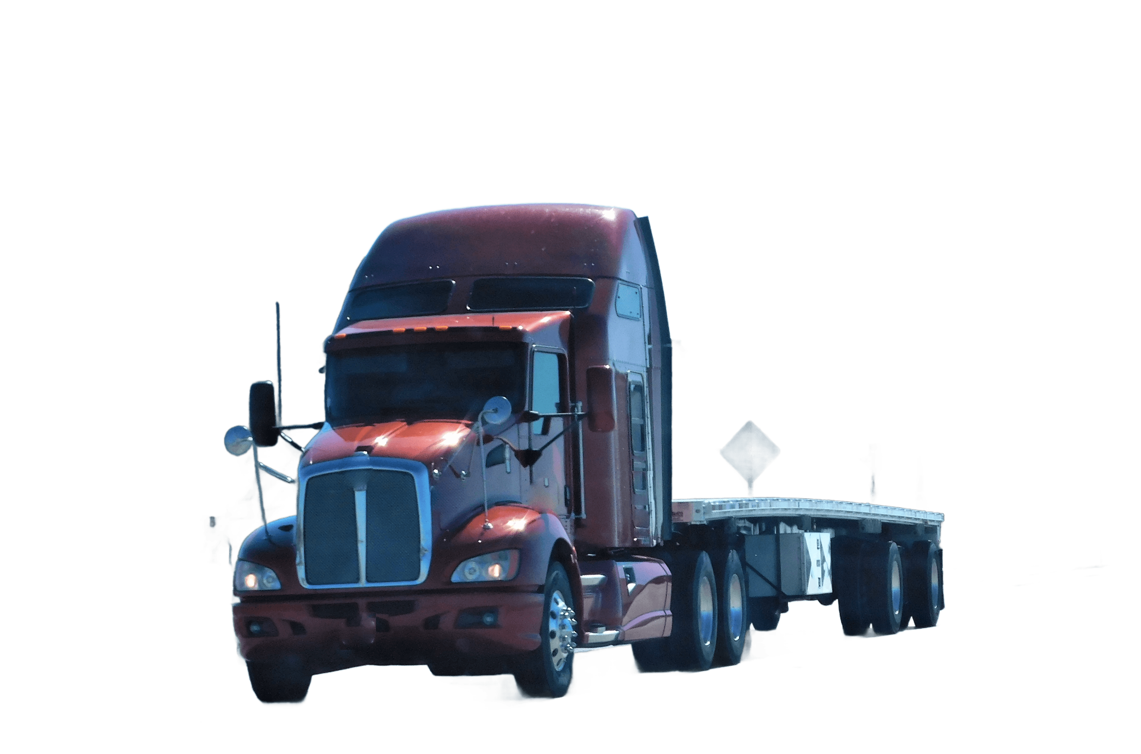 American flatbed trailer on highway with mountains